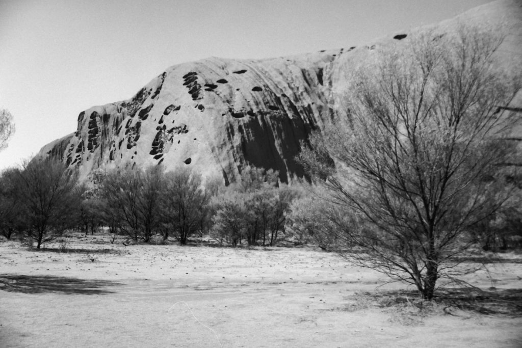 Black and white photograph of Uluru