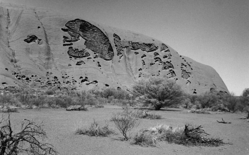 Black and white photograph of Uluru