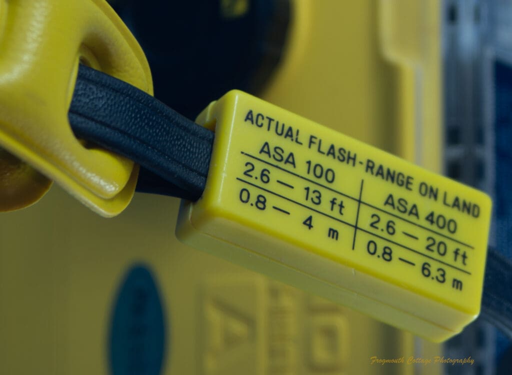 Photograph of the wrist strap flash instructions on the Minolta Weathermatic A