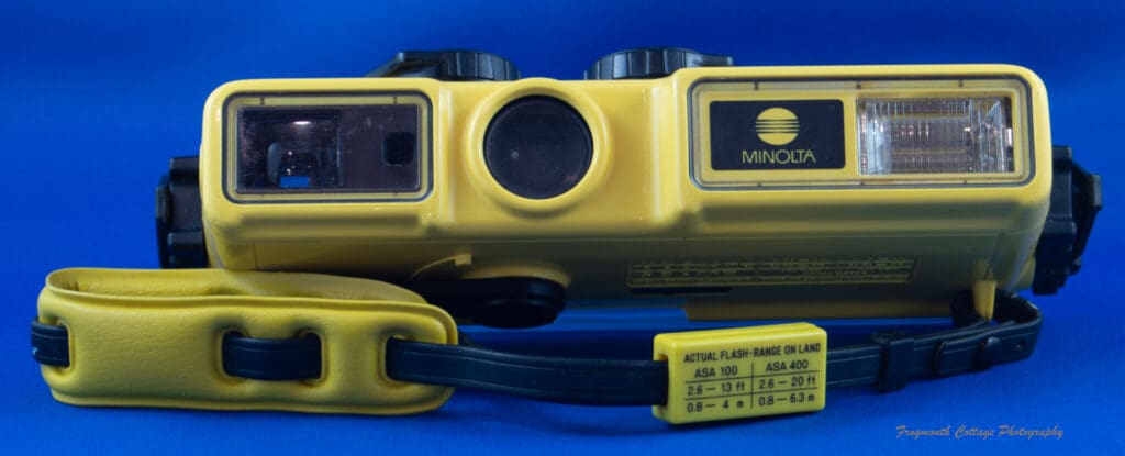 Photograph of the Minolta Weathermatic A withwrist strap.